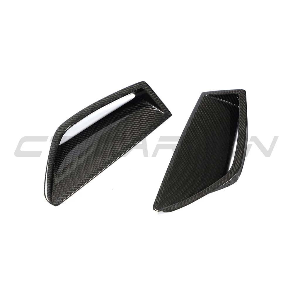 Audi RS6 C8 2019+ full carbon fibre front end kit by CT Carbon, including bumper vent trim on a sleek, sporty vehicle.
