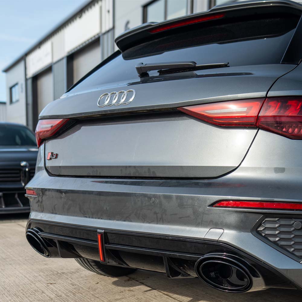 CT Carbon Audi S3/A3 8Y S-Line gloss black diffuser with tips and LED light, showcasing sleek automotive design.