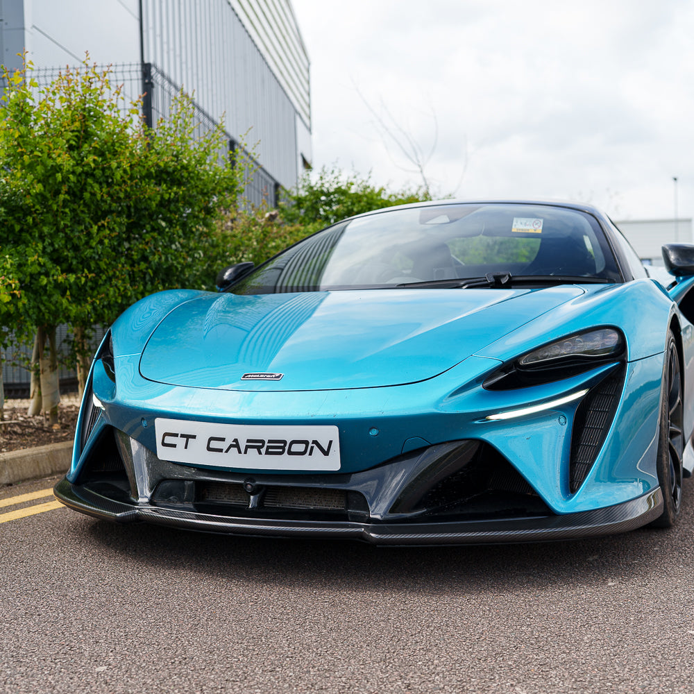 CT Carbon McLaren Artura 2023 carbon fibre splitter installed on the front of the sports car, showcasing sleek aerodynamic design.