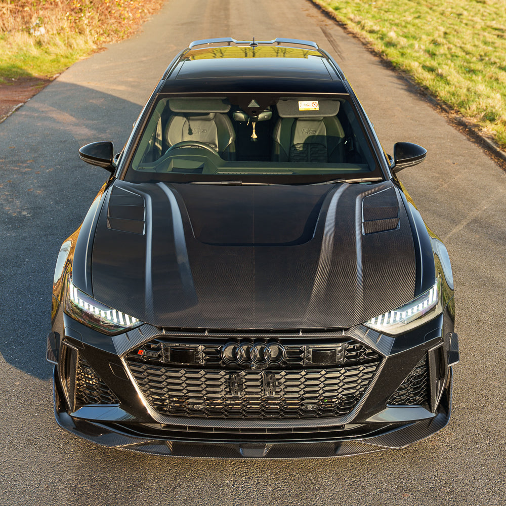 Carbon fiber hood for Audi A6, A7, S6, S7, RS6, RS7 C8 models by CT Carbon, showing sleek black finish and lightweight design.