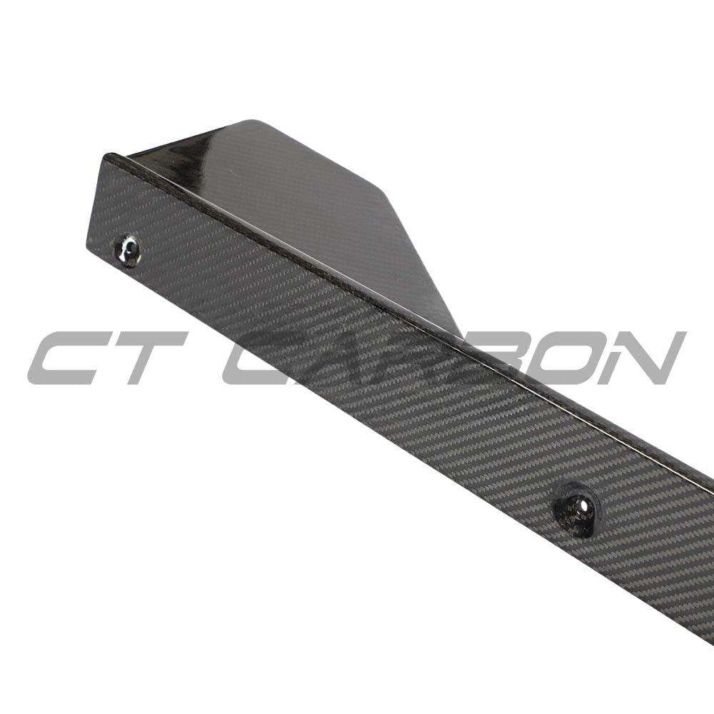 BMW 1 Series F40 carbon fibre side skirts from CT Design, showcasing sleek, aerodynamic car styling with a glossy finish.