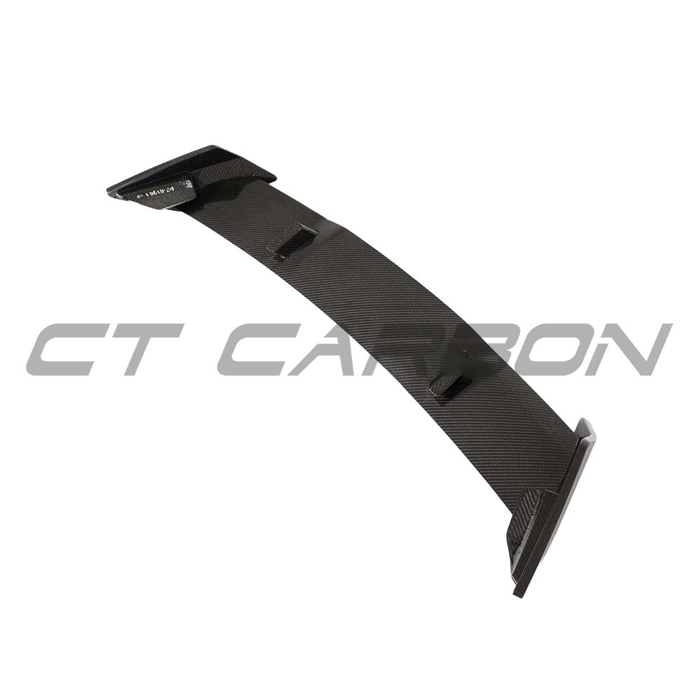 BMW 1 Series F40 2019-2024 CT Design full carbon fibre kit, including carbon wing, on a sleek sports car.