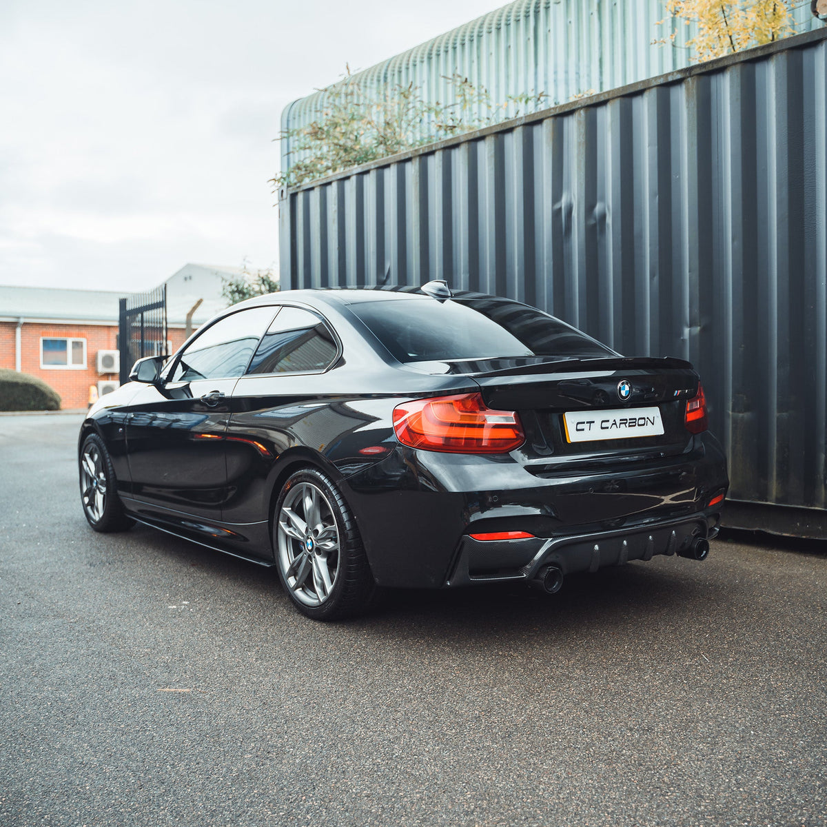 BMW 2 Series F22/F23 carbon fibre diffuser by CT Carbon, showcasing sleek black vented design for enhanced aerodynamics.
