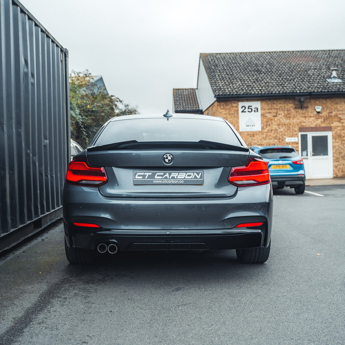BMW 2 Series F22/F23 CT Carbon gloss black twin exhaust diffuser with MP style finish, designed for sporty rear aesthetics.