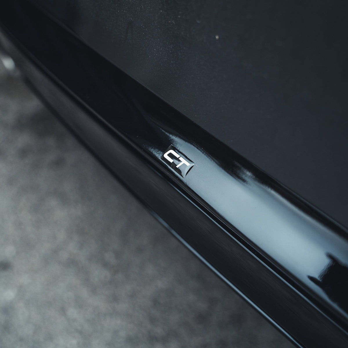 BMW 2 Series F22 F23 gloss black twin exhaust diffuser by CT Carbon, showing the sleek diffuser with dual exhaust cutouts.