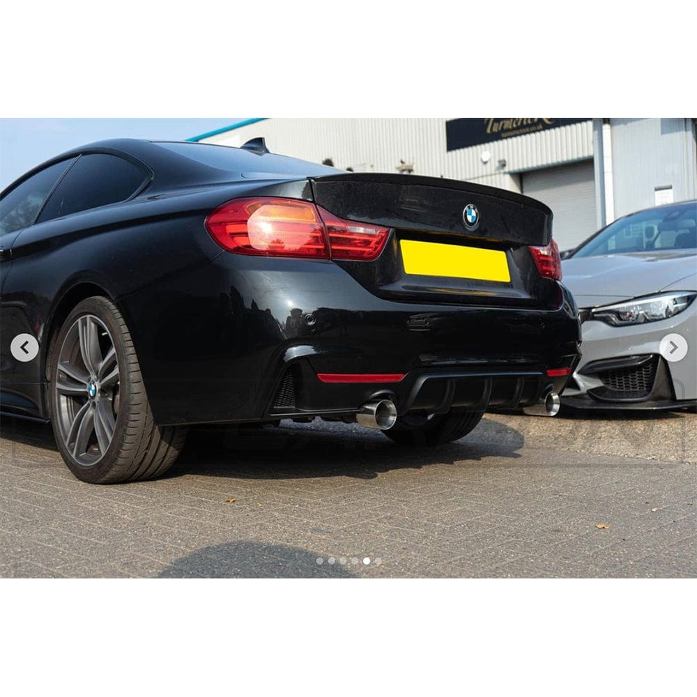 BMW 4 Series F33 gloss black full kit with twin exhaust by CT Carbon, featuring MP style design and detailed craftsmanship.