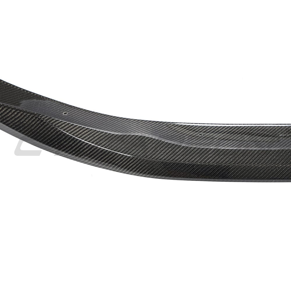 BMW G22 4 Series carbon fibre kit by CT Carbon, featuring splitter and MP style design on a sleek vehicle.