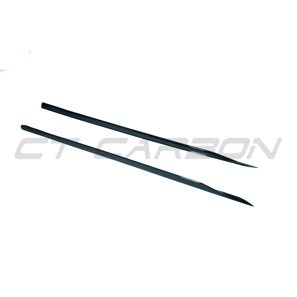 BMW 5 Series G60 2023 gloss black side skirts by CT Carbon, showing the sleek, aerodynamic design on the vehicle.
