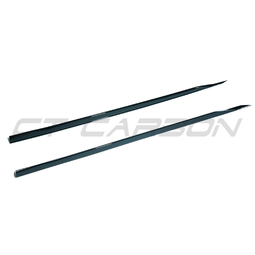 BMW 5 Series G60 2023 gloss black side skirts by CT Carbon, showcasing sleek, aerodynamic design on the vehicle's sides.