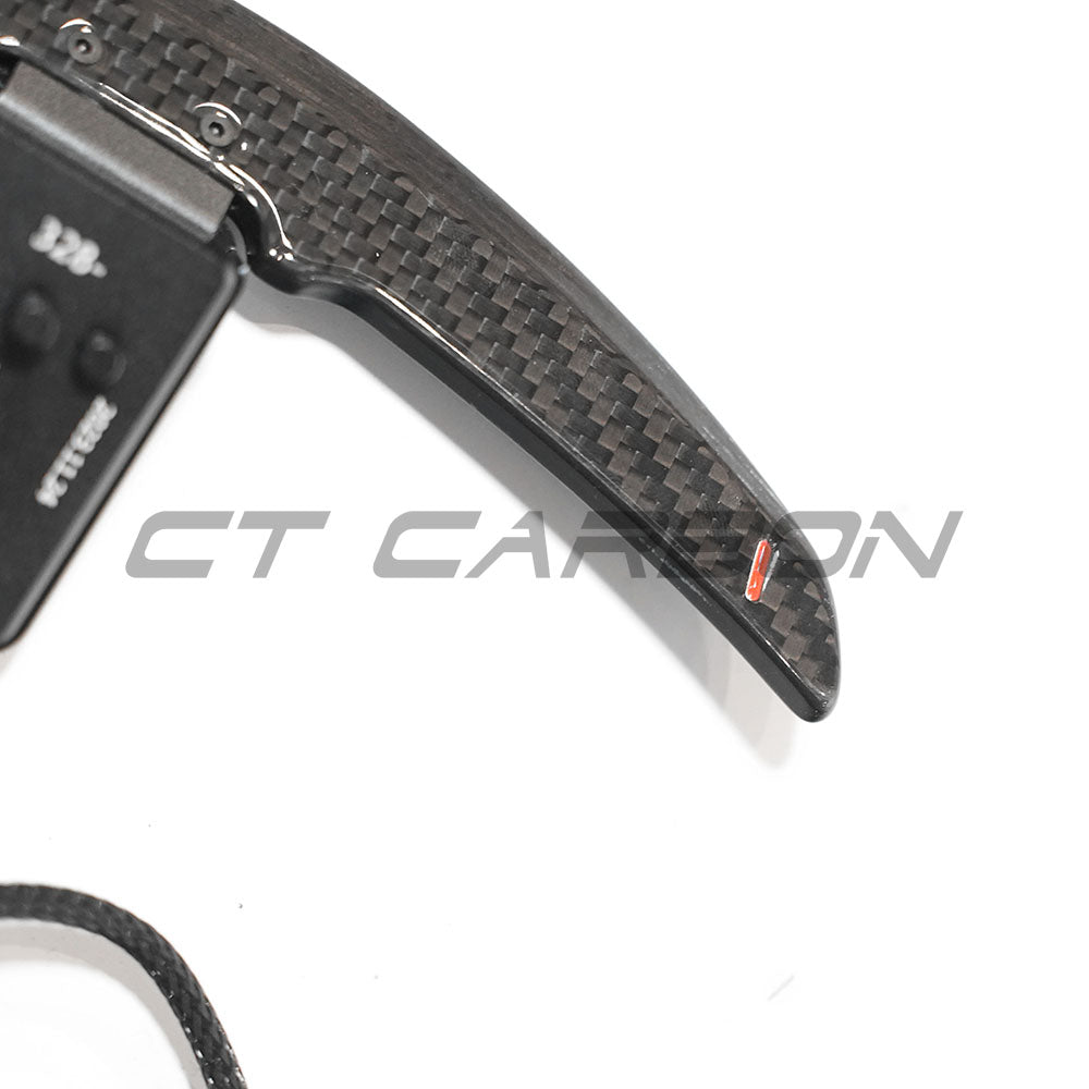 BMW carbon fiber magnetic shifter paddles by CT Carbon, sleek automotive accessories designed for sporty driving control.