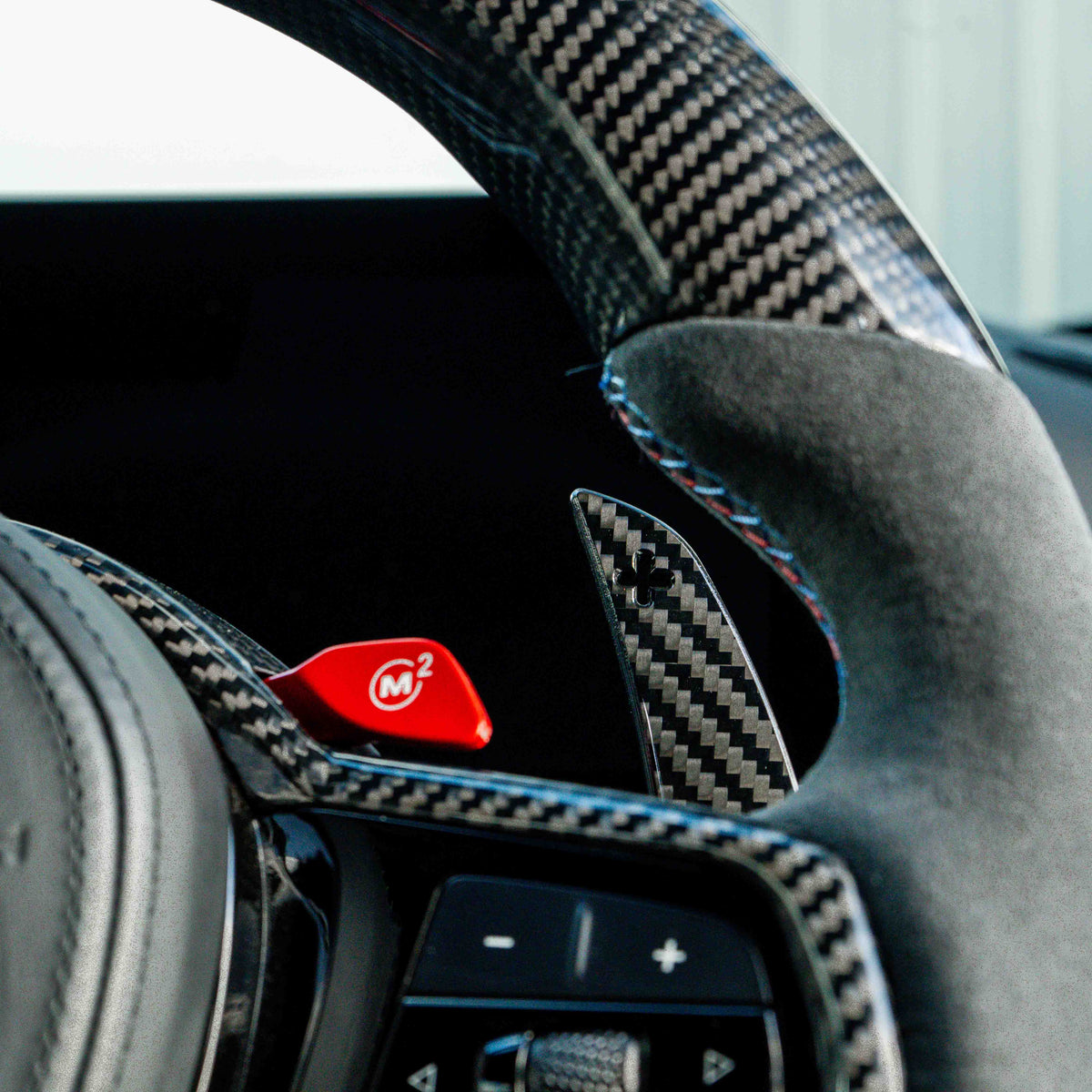 BMW carbon fiber magnetic shifter paddles by CT Carbon, featuring sleek, lightweight design for sporty driving.