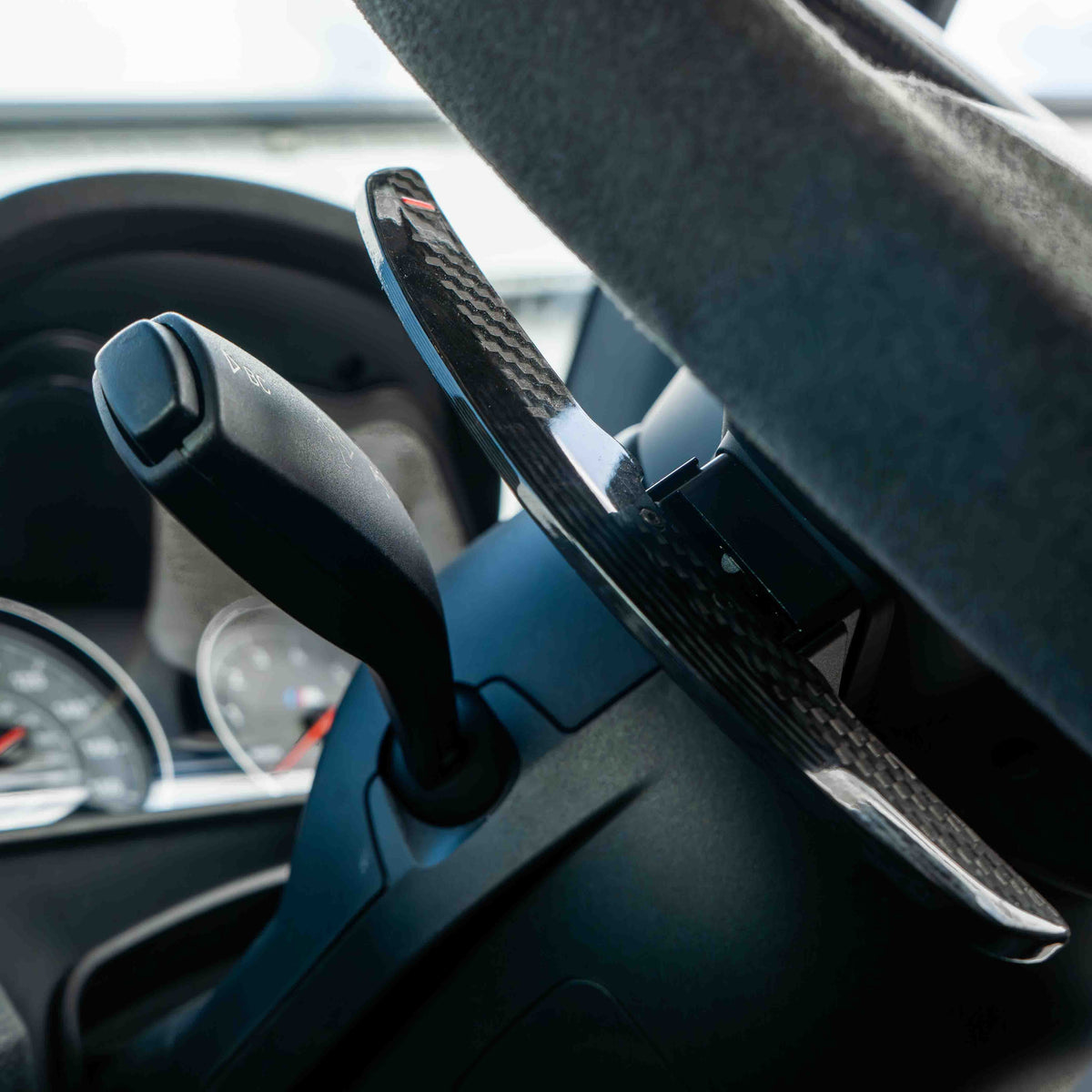 BMW carbon fiber magnetic shifter paddles by CT Carbon, sleek and lightweight automotive accessories for enhanced driving style.