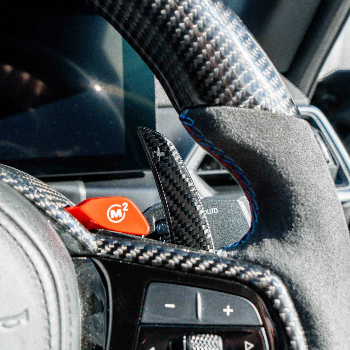 BMW carbon fiber magnetic shifter paddles by CT Carbon, showcasing sleek, lightweight racing-inspired accessories for car interior.