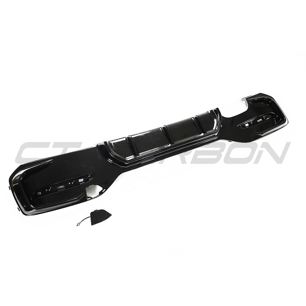 BMW F20/F21 1 Series G30 gloss black LCI diffuser by CT Carbon, twin left side view showing sleek automotive styling.