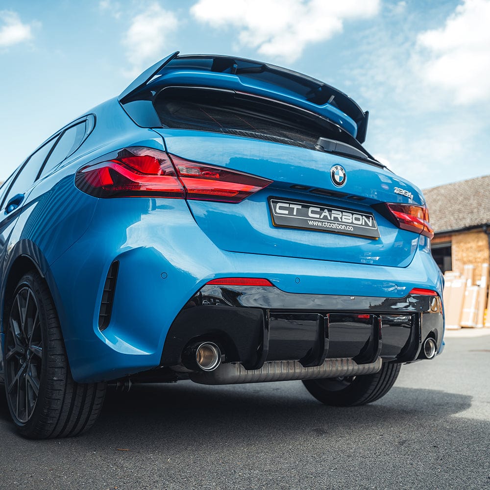 BMW F40 and F70 1 Series 2019+ CT Carbon gloss black spoiler, V1 style, mounted on the car's rear for sporty enhancement.