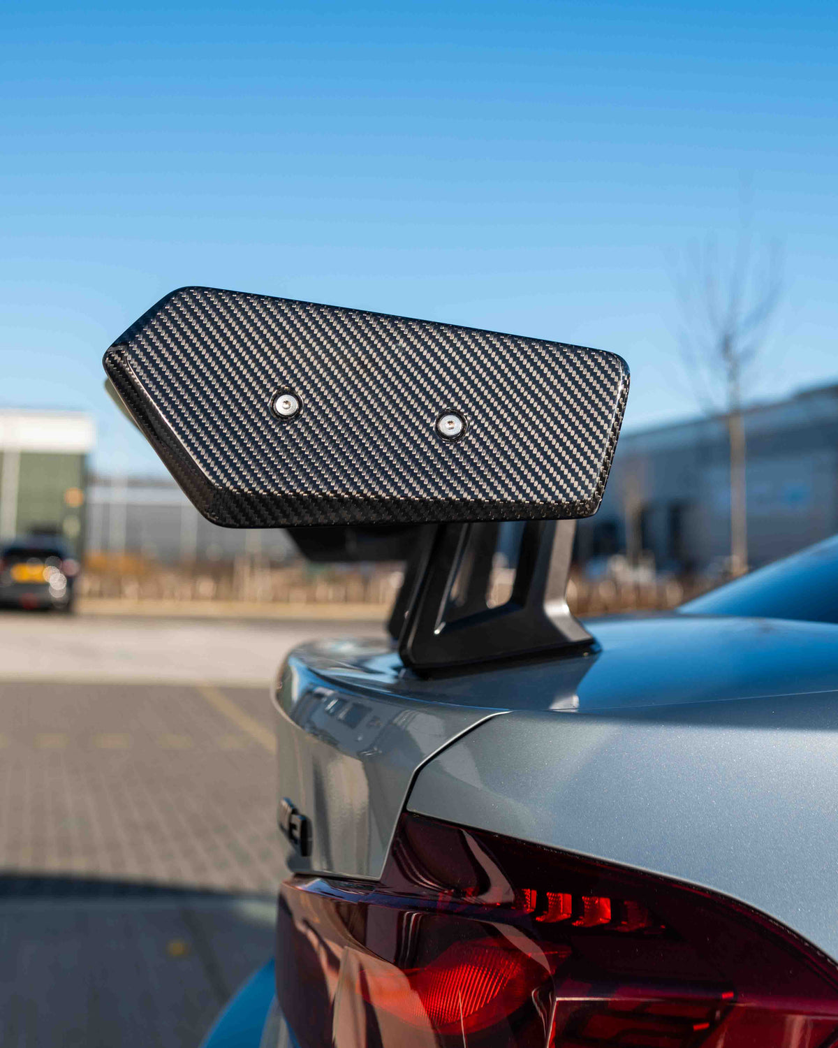 BMW F80 M3 and F30 3 Series carbon fibre swan neck wing spoiler by CT Design, showcasing sleek aerodynamic design.