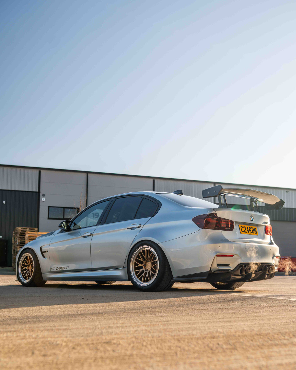 BMW F80 M3 and F30 3 Series carbon fibre swan neck wing spoiler by CT Carbon, showcasing aerodynamic design and lightweight construction.