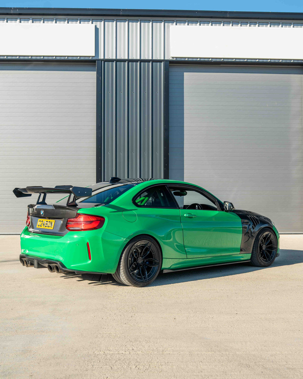 BMW F87 M2 and F22 2 Series carbon fibre swan neck wing spoiler by CT Carbon, showcasing sleek, aerodynamic design.