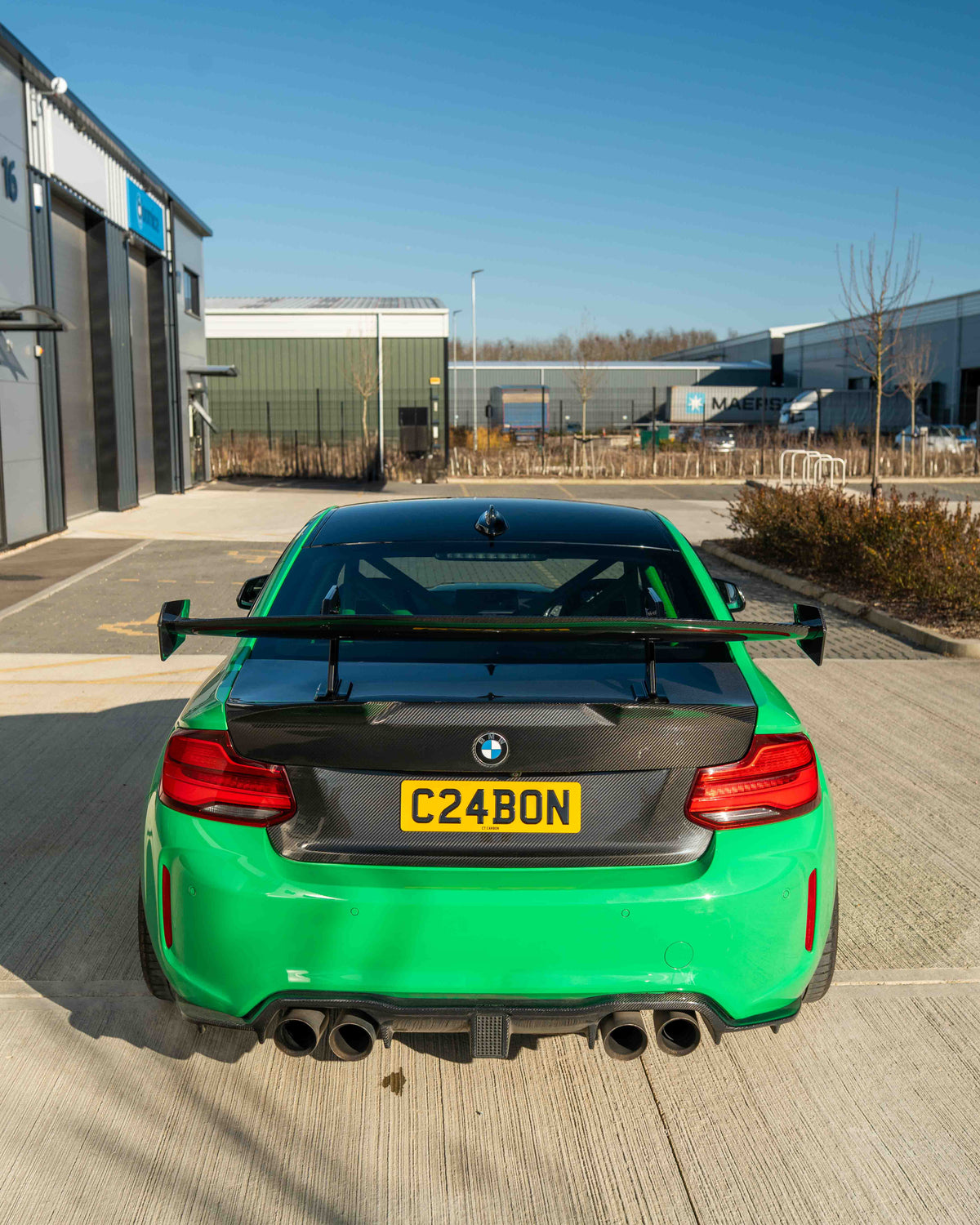 BMW F87 M2 and F22 2 Series carbon fibre swan neck wing spoiler by CT Carbon, showcasing sleek aerodynamic design.