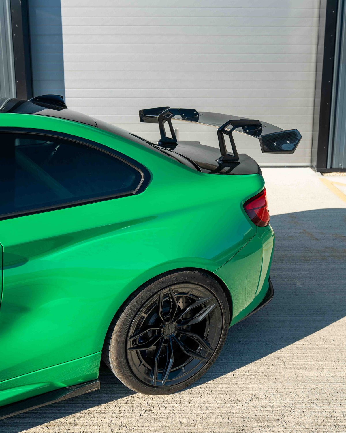 BMW F87 M2 and F22 2 Series carbon fibre swan neck wing spoiler by CT Carbon, showcasing sleek, aerodynamic design.