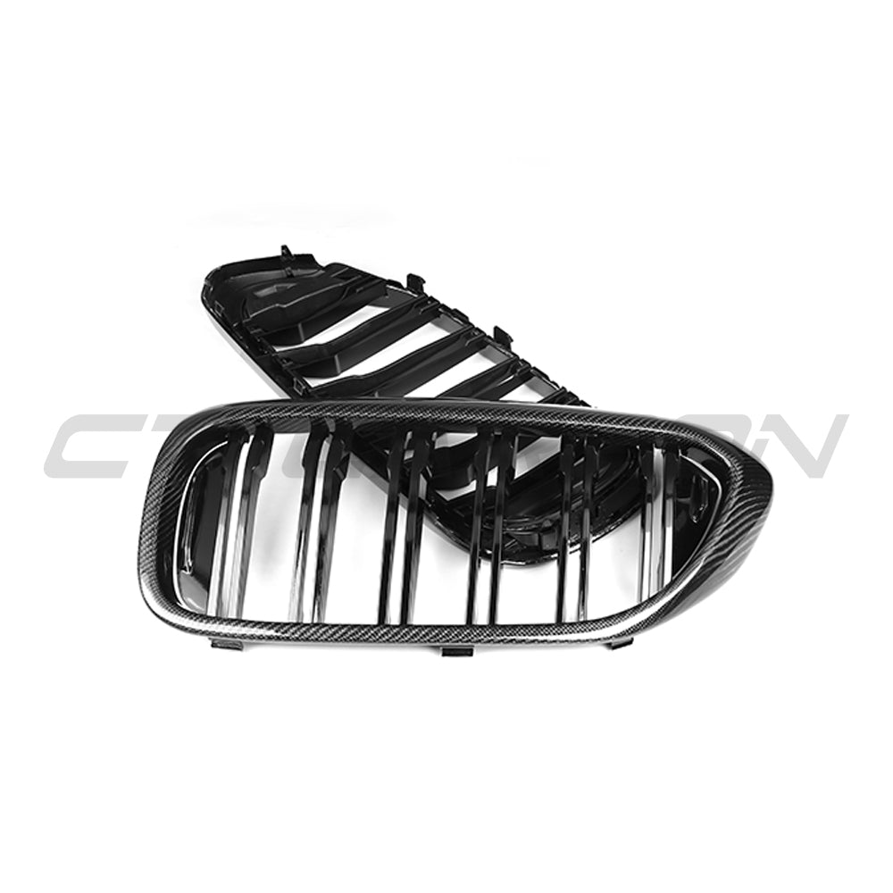 BMW F90 M5 and G30 G31 5 Series pre-LCI carbon fiber grille by CT Carbon, showcasing sleek black textured finish on the front of the vehicle.
