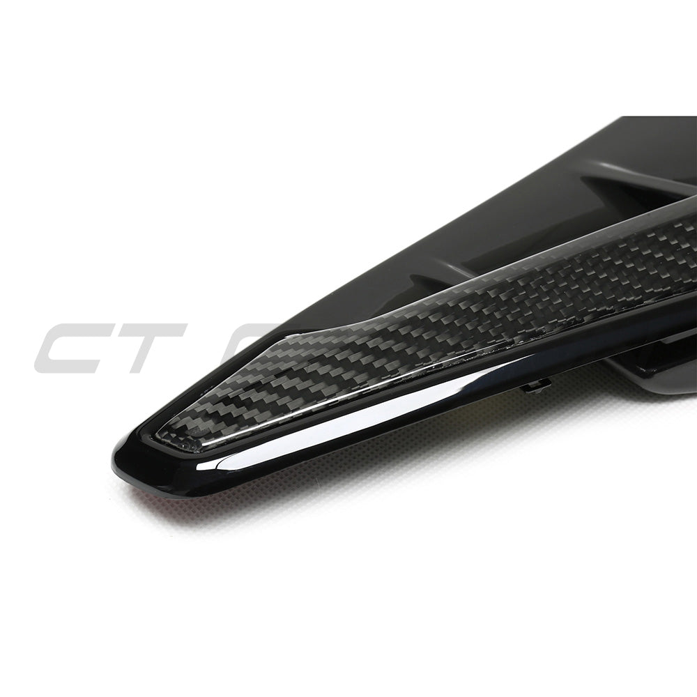 BMW F95 X5M 2019-2022 pre-LCI carbon fiber front fender trim accessory by CT Carbon, showing close-up of sleek black finish.