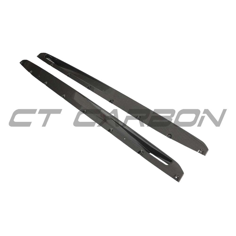 BMW F95 X5M 2019-2022 CT Design carbon fibre side skirts kit installed on the vehicle, showcasing sleek, aerodynamic design.