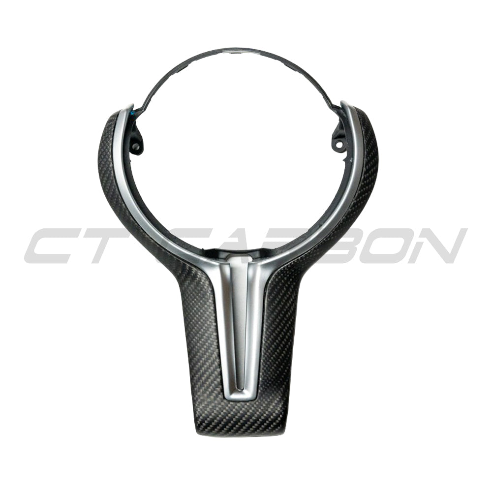 BMW Fxx M carbon fiber steering wheel trim accessory by CT Carbon, featuring a matte finish and sleek design.