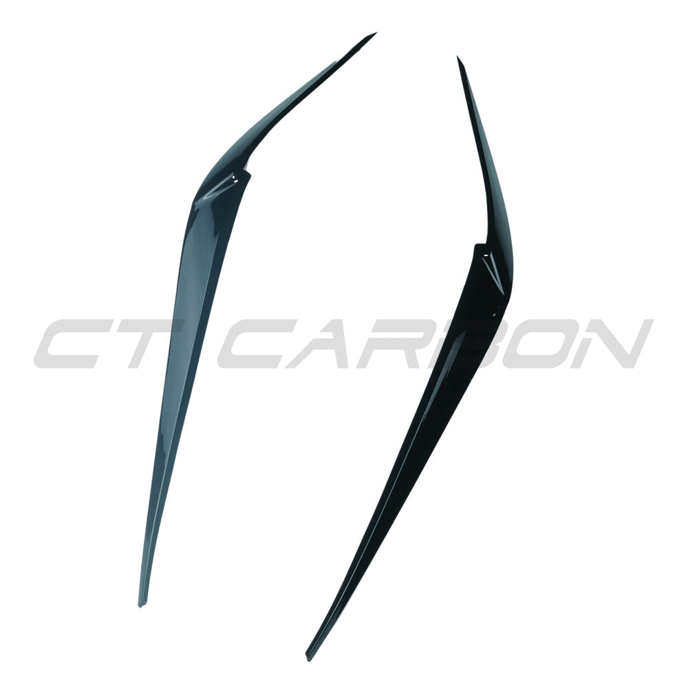BMW G01 G02 F97 F98 X3 X4 X3M X4M gloss black headlight eyebrows accessory by CT Carbon, showing sleek, curved headlight trim.