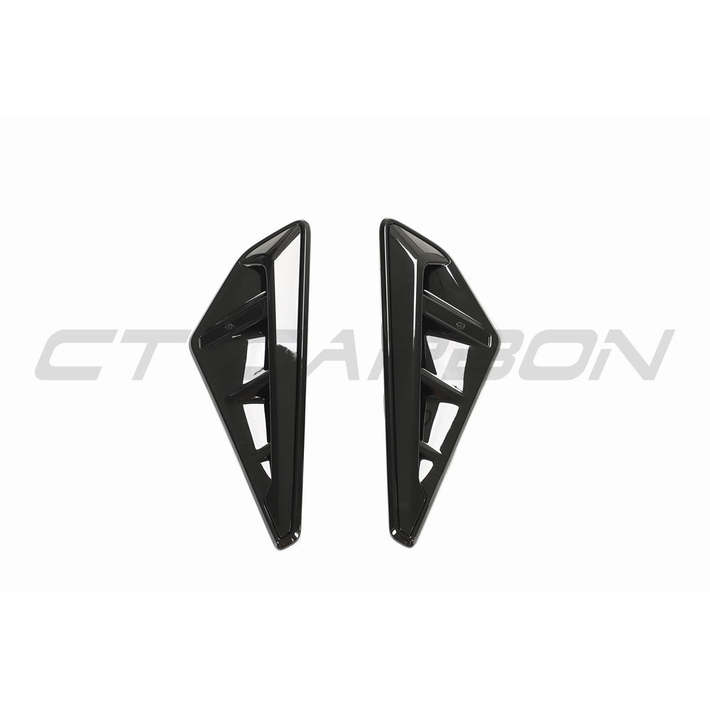BMW G05 X5 gloss black fender trim accessory by CT Carbon, close-up view of sleek, shiny black exterior trim piece.