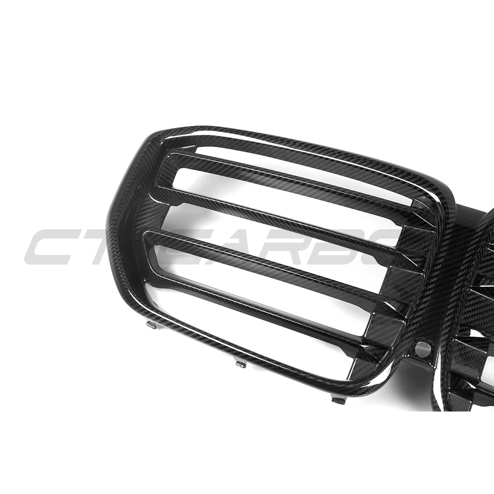 BMW G05 X5 LCI carbon fibre grille by CT Carbon, close-up view showing sleek black finish and detailed mesh design.