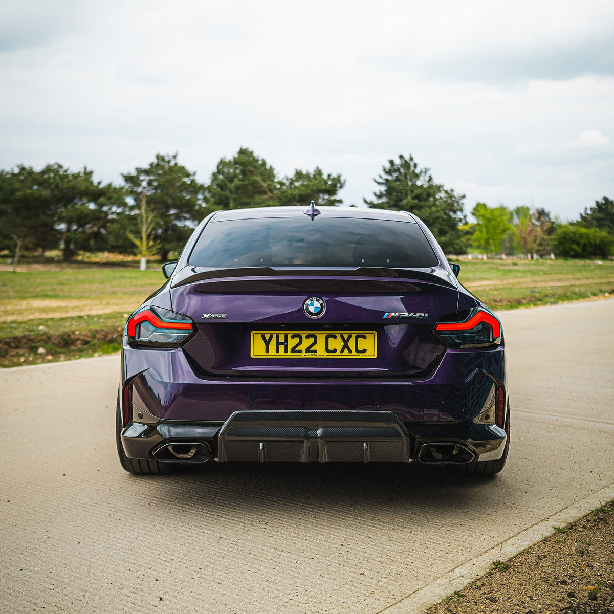 BMW G42 2 Series 2022+ carbon fiber diffuser by CT Carbon, V1, showcasing sleek, aerodynamic design for sporty appearance.