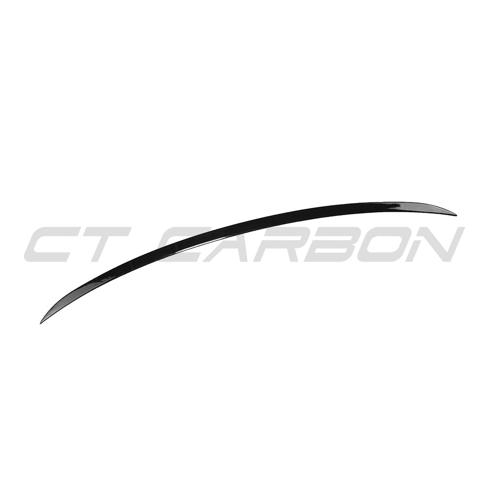 BMW G60 and i5 5 Series 2023 gloss black spoiler by CT Carbon, shown installed on the vehicle's rear.