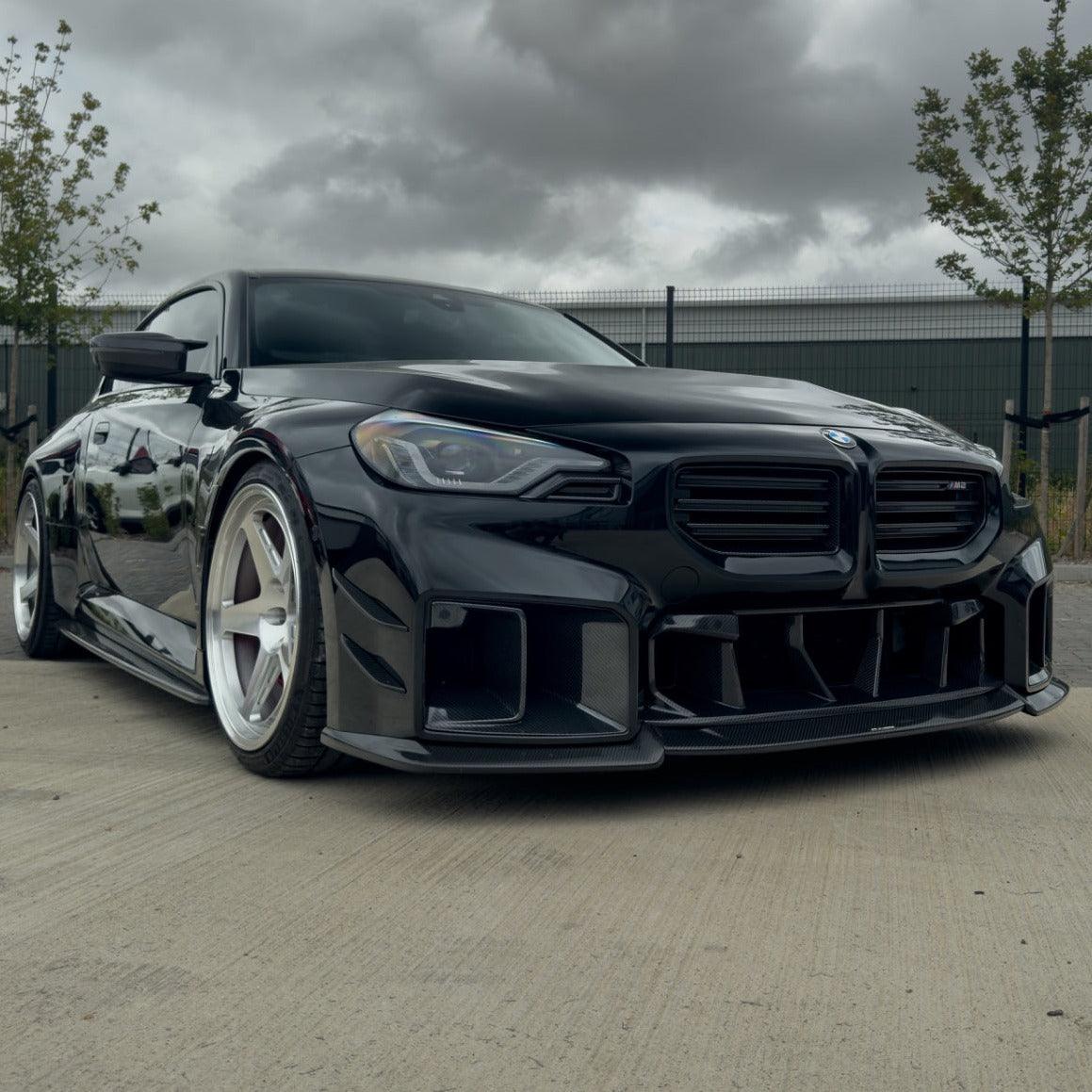 BMW G87 M2 carbon fiber ducts by CT Carbon, V2 accessories, close-up view of sleek, lightweight carbon fiber vents.