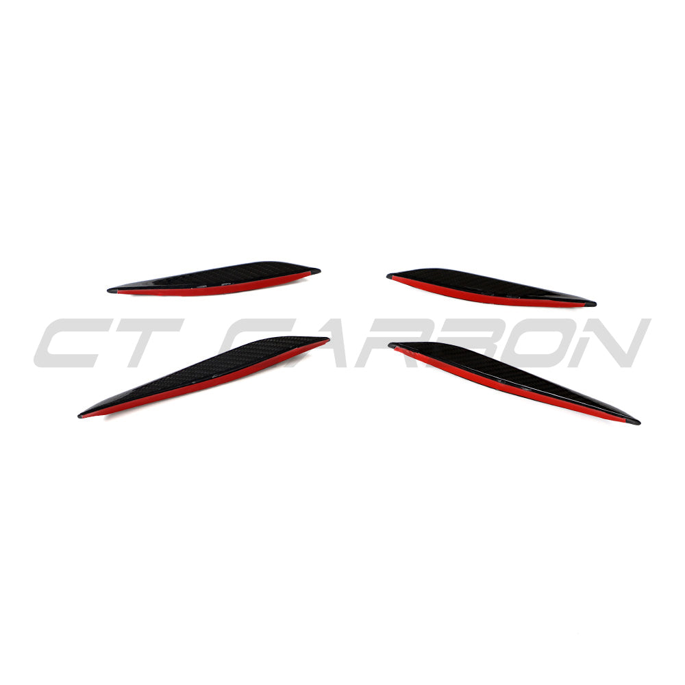 BMW G87 M2 carbon fiber front bumper canards by CT Carbon, close-up view of aerodynamic car accessories