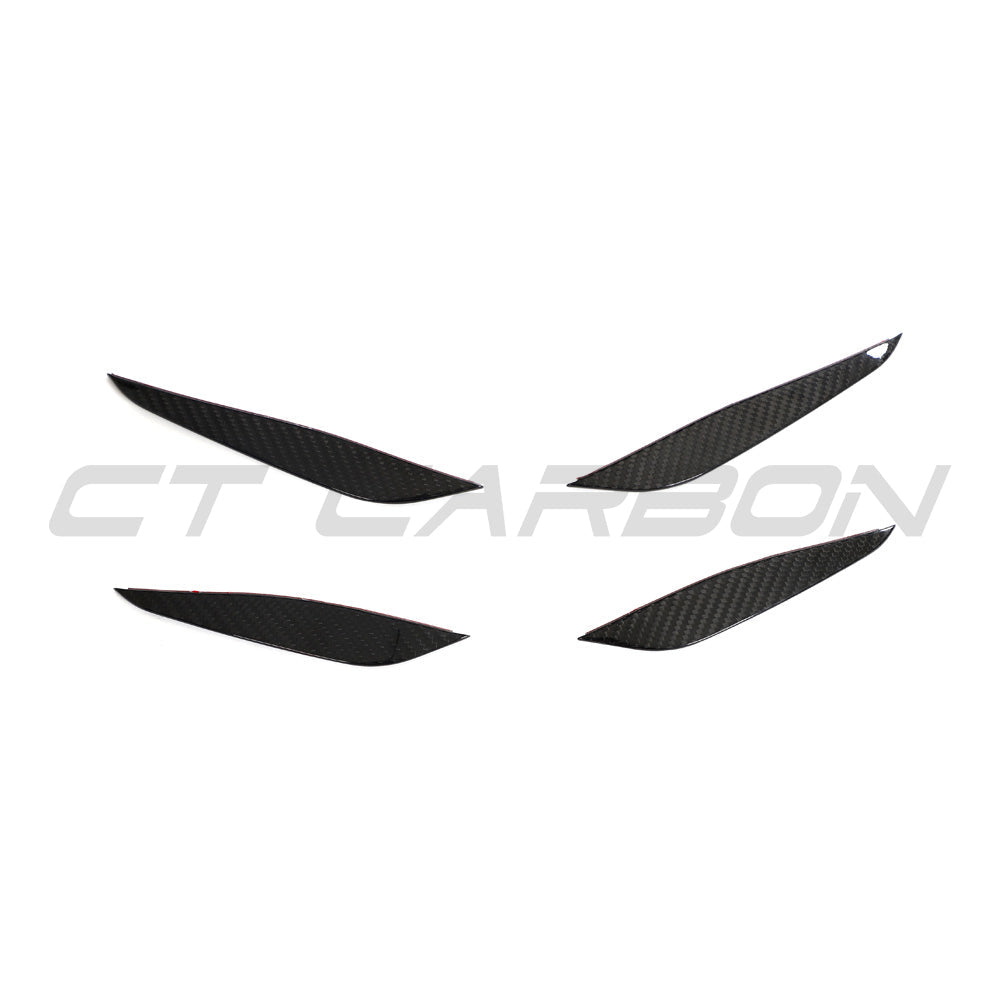 BMW G87 M2 carbon fiber front bumper canards by CT Carbon, showing sleek aerodynamic design and lightweight carbon fiber material