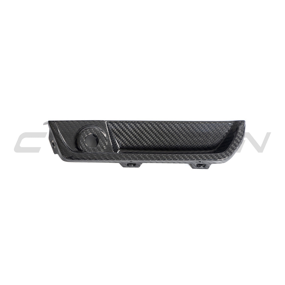 BMW G87 M2 carbon fiber reflector delete accessory by CT Design, showcasing sleek black carbon fiber surface and precise fit.