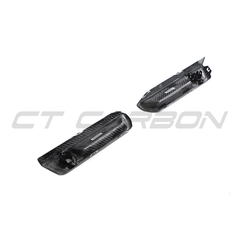BMW G87 M2 carbon fiber reflector delete accessory by CT Carbon, showing sleek black carbon fiber finish on the vehicle's side.