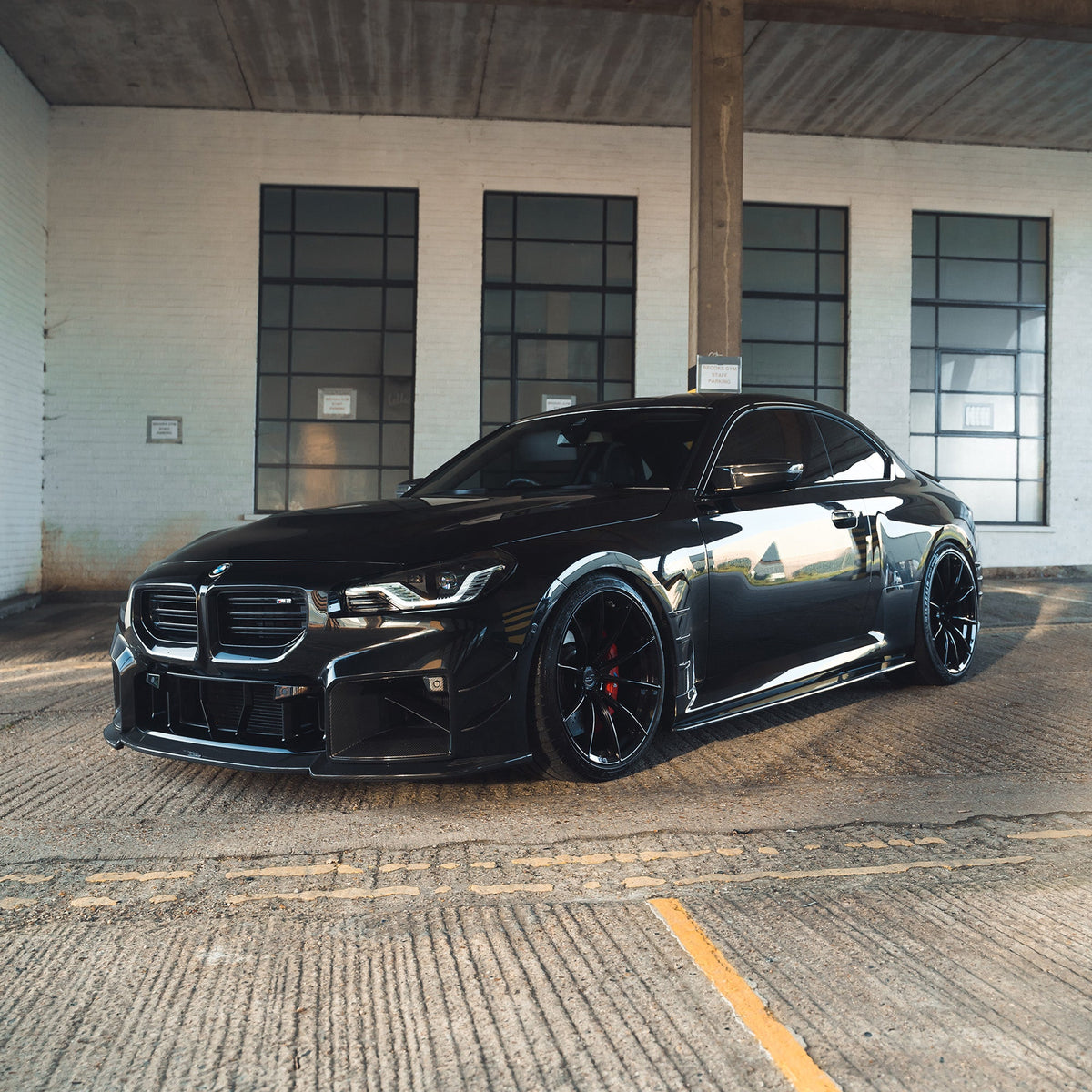 BMW G87 M2 carbon fiber side skirts by CT Design, showcasing sleek, lightweight aerodynamic enhancements for the vehicle.