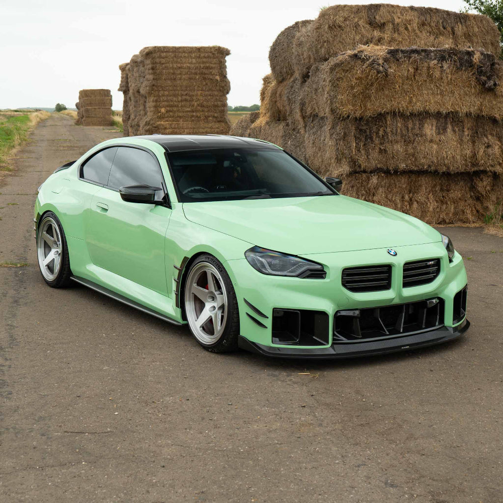 BMW G87 M2 carbon fibre splitter by CT Carbon, V4 version, showcasing lightweight aerodynamic design.
