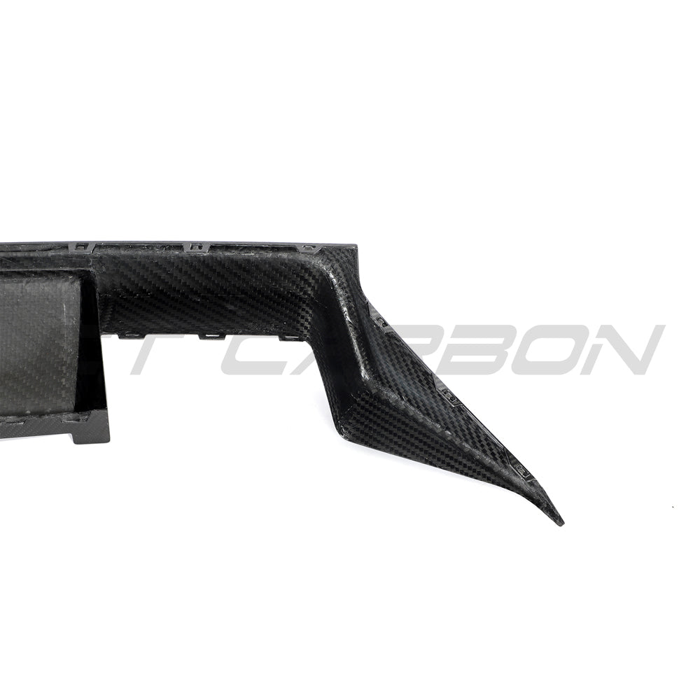 BMW G87 M2 full carbon fiber kit by CT Carbon, showing detailed front bumper, side skirts, and rear diffuser in high-quality finish.