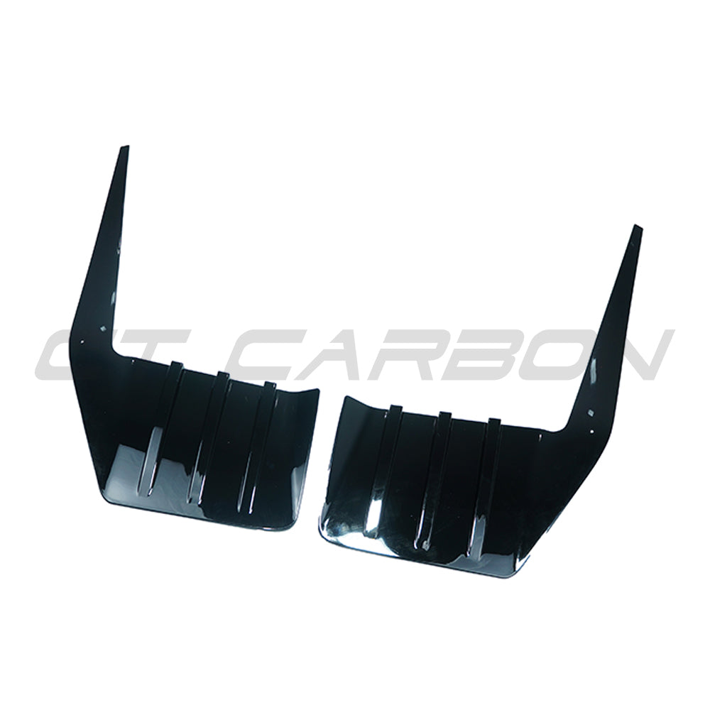 BMW G87 M2 gloss black rear bumper trim accessory by CT Carbon, showcasing the sleek, reflective finish on the vehicle's rear bumper area.