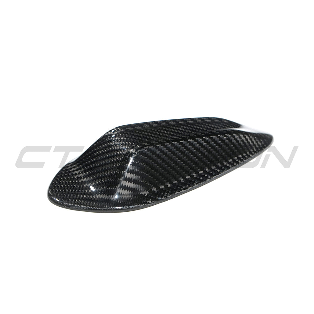 BMW Gxx G42 G80 G82 G20 G22 G87 carbon fibre antenna cover by CT Carbon, close-up of sleek black textured automotive accessory.