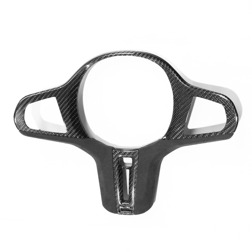 BMW Gxx M carbon fiber steering wheel trim with heating feature, accessory by CT Carbon, showing sleek, textured carbon fiber design.