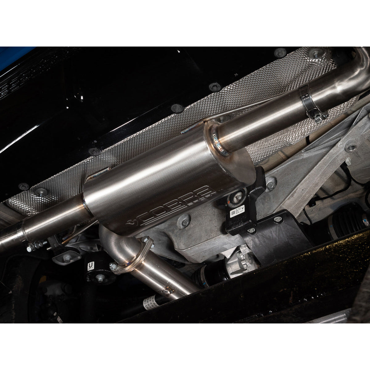Cobra Sport BMW M135i F40 cat back performance exhaust system with polished tips and metal piping visible.
