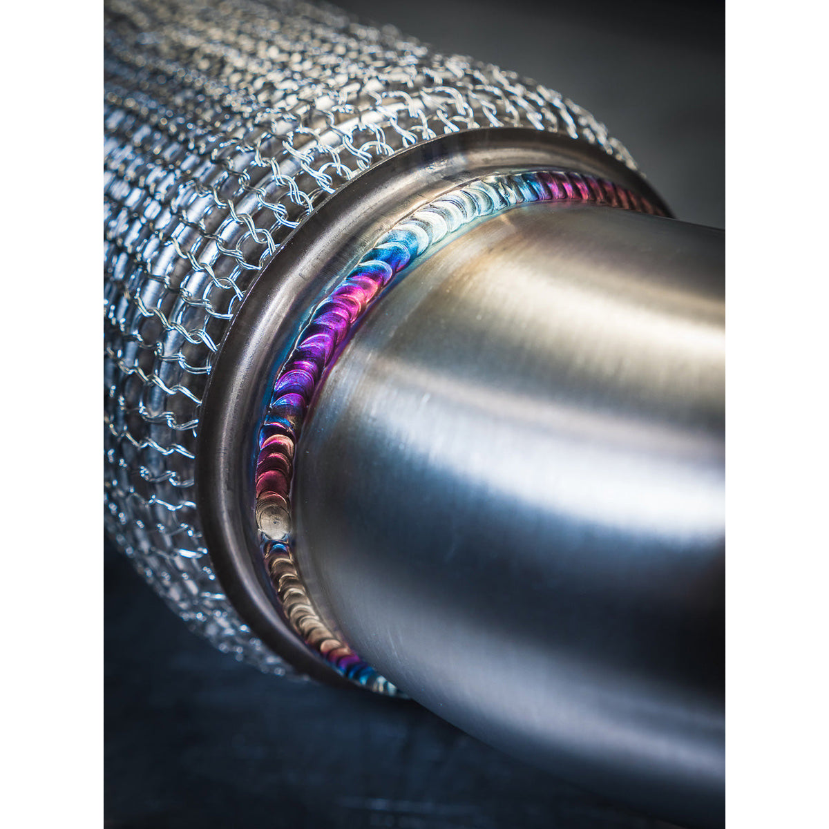 Cobra Sport BMW M235i F44 front downpipe sports cat and de-cat exhaust component, showcasing metallic construction and connection points.