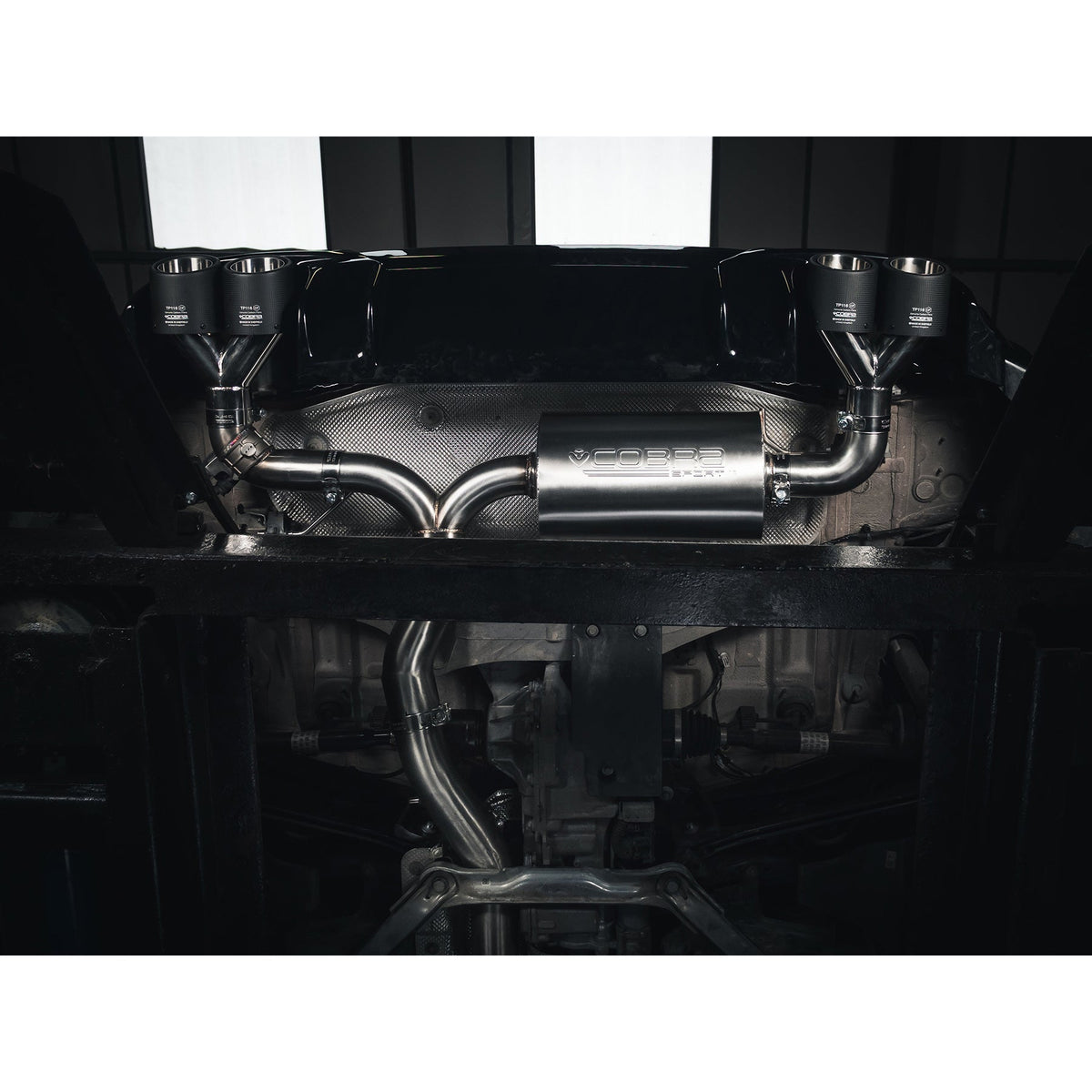 BMW M135i F40 with Cobra Sport quad exit M3 style cat back performance exhaust installed, showcasing the sleek exhaust system.