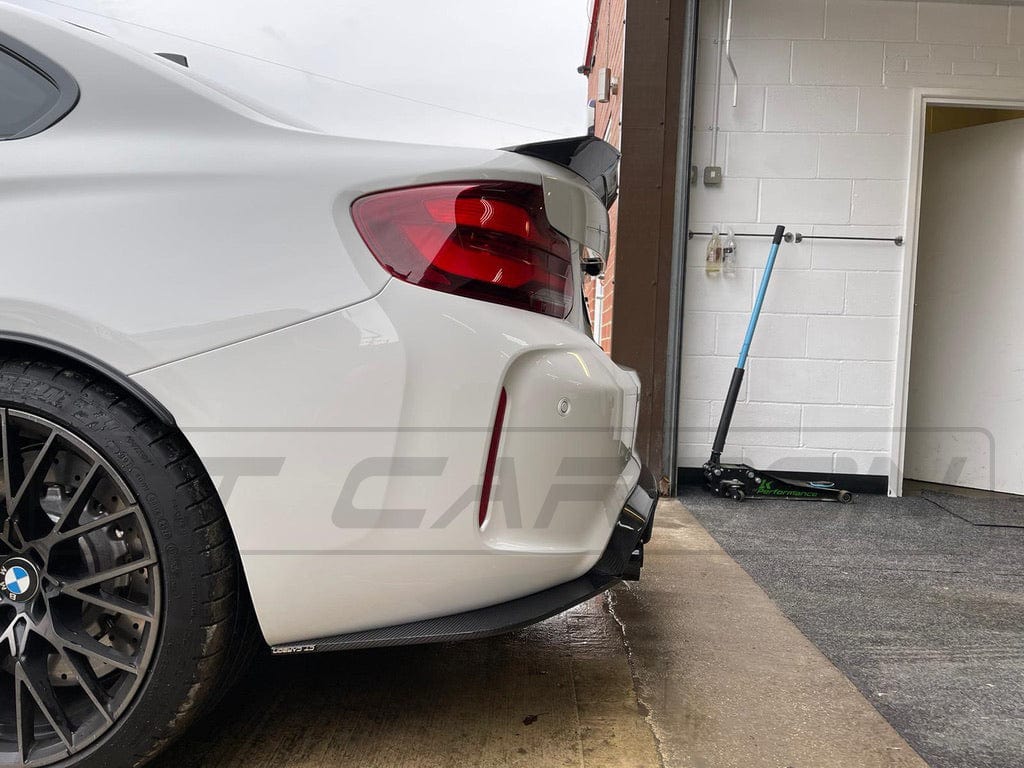 BMW M2 F87 carbon fiber diffuser by CT Carbon, V3 style, showcasing sleek aerodynamic design and high-quality finish.