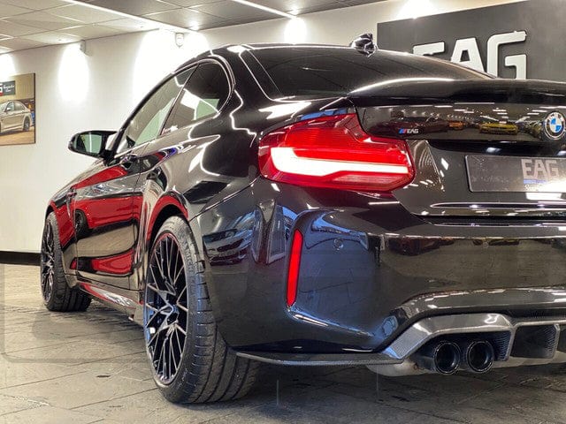 BMW M2 F87 carbon fiber diffuser by CT Carbon, V3 style, showcasing sleek aerodynamic design for performance and style.