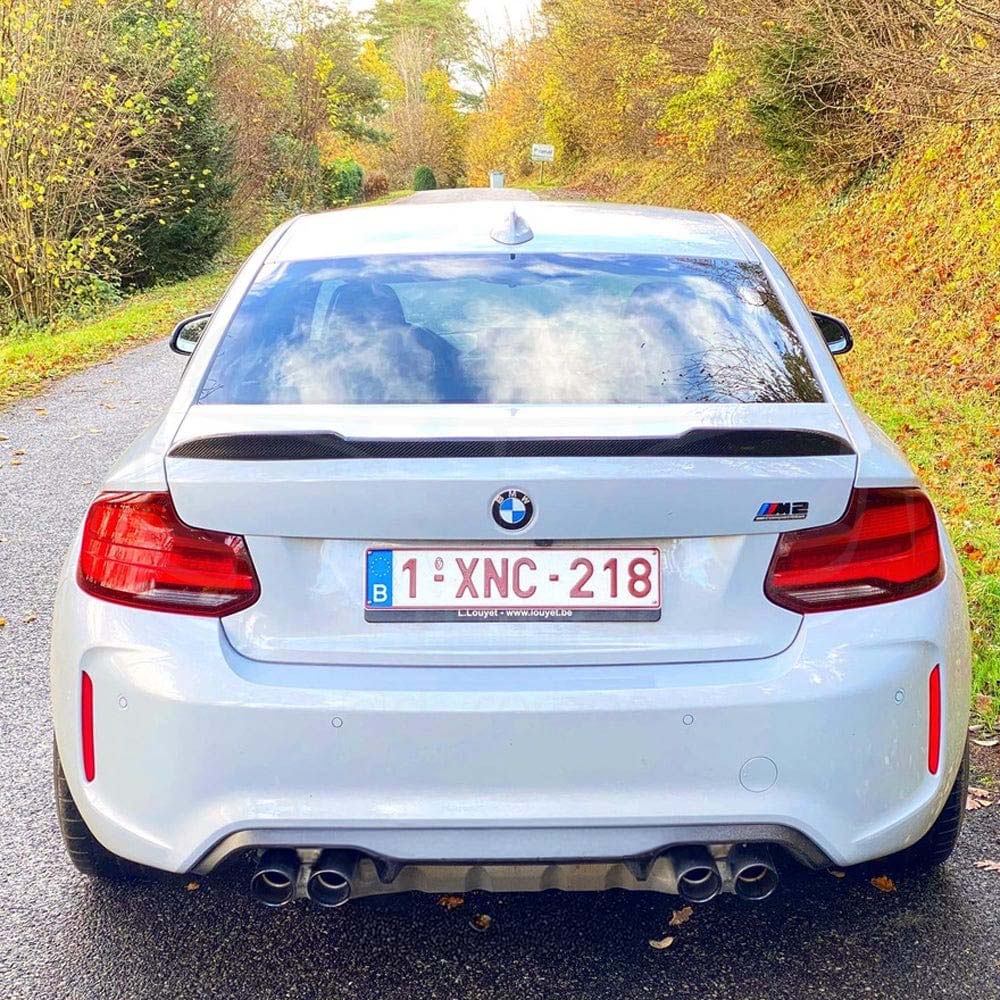 BMW M2 F87 and F22 carbon fibre spoiler by CT Carbon, showcasing sleek, aerodynamic design on a sporty car.